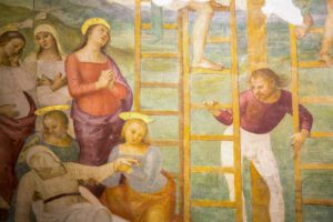 Dettaglio dell'affresco del perugino. Maria, svenuta, viene sorretta da due donne mentre suo figlio viene rimosso dalla croce.