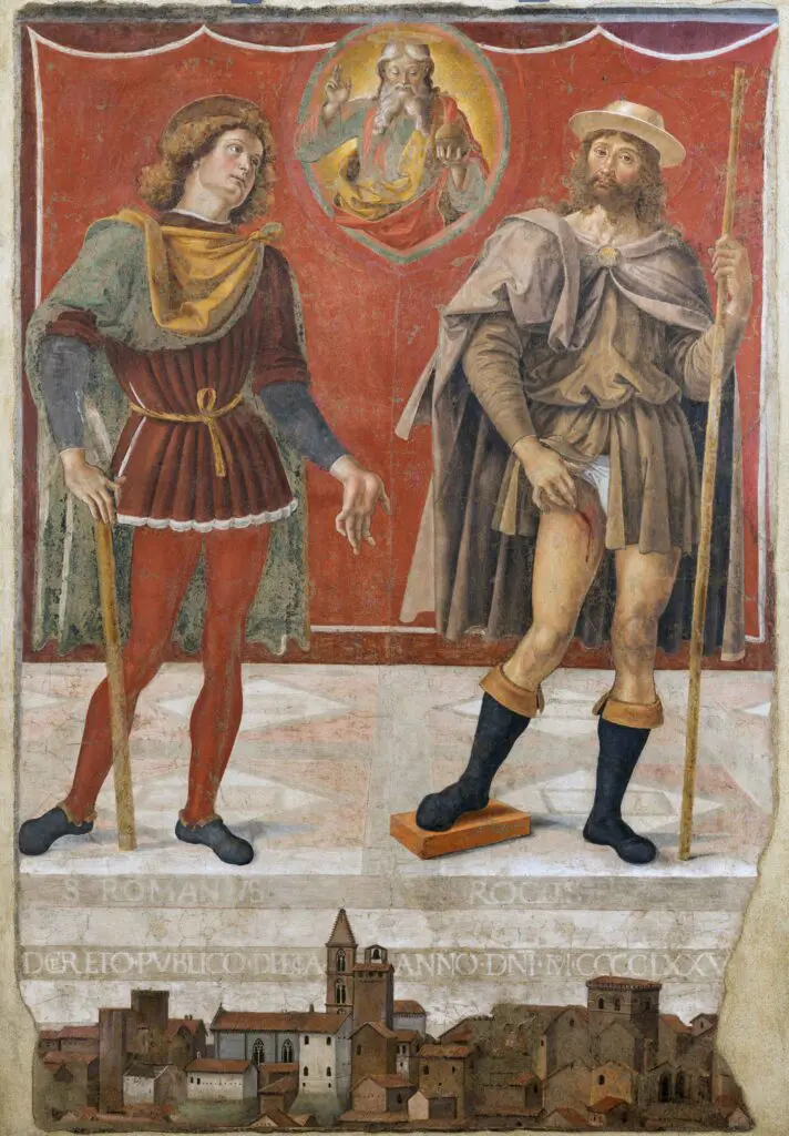 San Romano in abiti rinascimentali rivolge lo sguardo verso Dio, inscritto in una cornice a forma di mandorla al centro dell’opera; San Rocco, vestito da pellegrino, guarda verso lo spettatore mostrando una ferita sanguinante sulla coscia destra, segno della peste che lo colpì durante la sua vita. Sotto i loro piedi un pavimento con motivi geometrici e ancora più in basso la città di Deruta, indicata anche da San Romano. Alle spalle dei due Santi, un drappo a tinta unita fa da sfondo alla composizione.